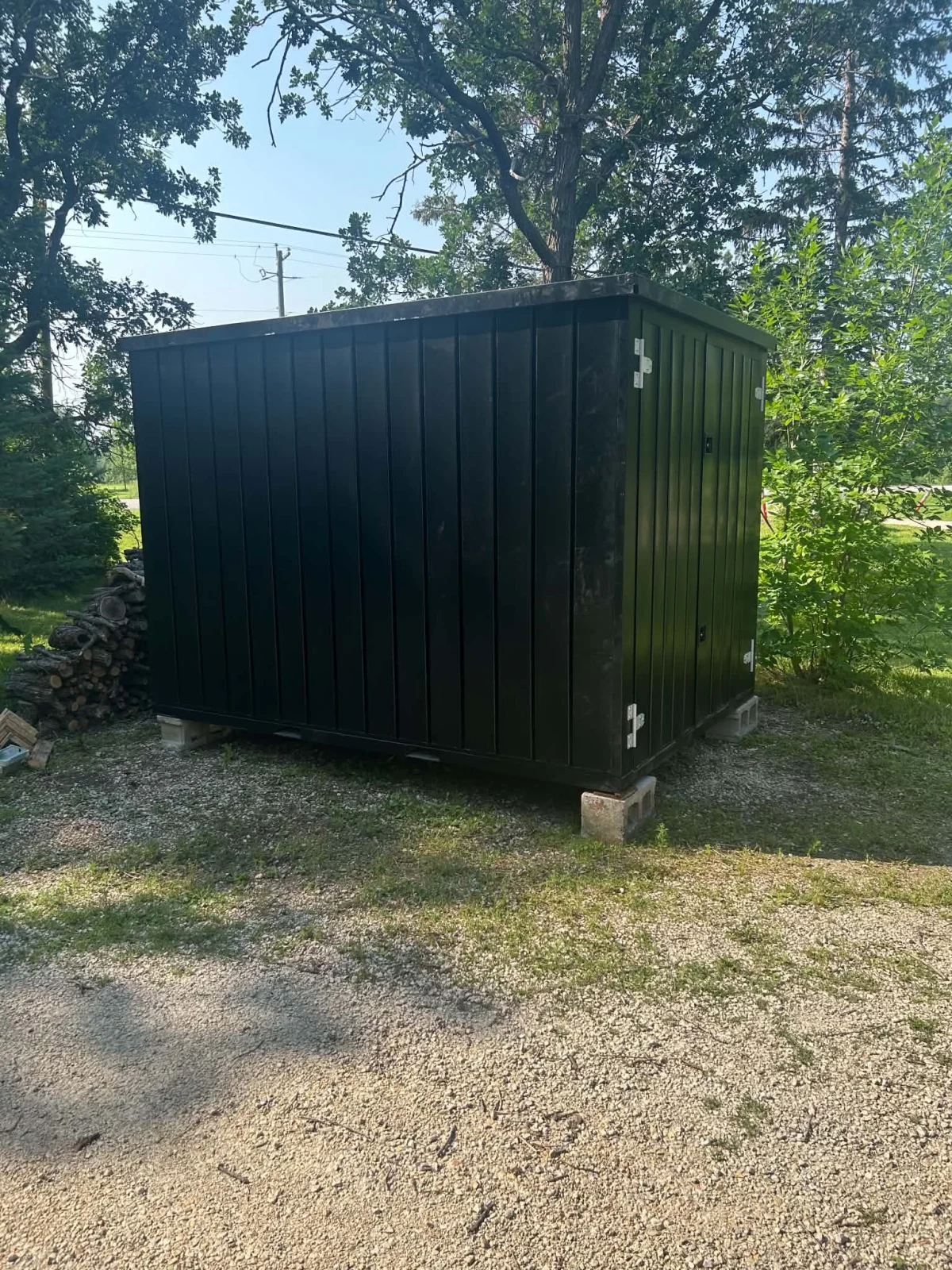 Black powder-coated flat-pack steel storage container